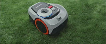 Robotic mower mowing lawn and turning